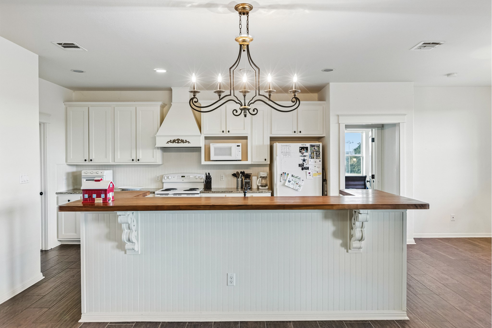 498 North County Line Road Elgin, TX 78621 - Photo 36 of 40 Kitchen with white cabinets, wooden counters, white appliances, decorative light fixtures, and recessed lighting