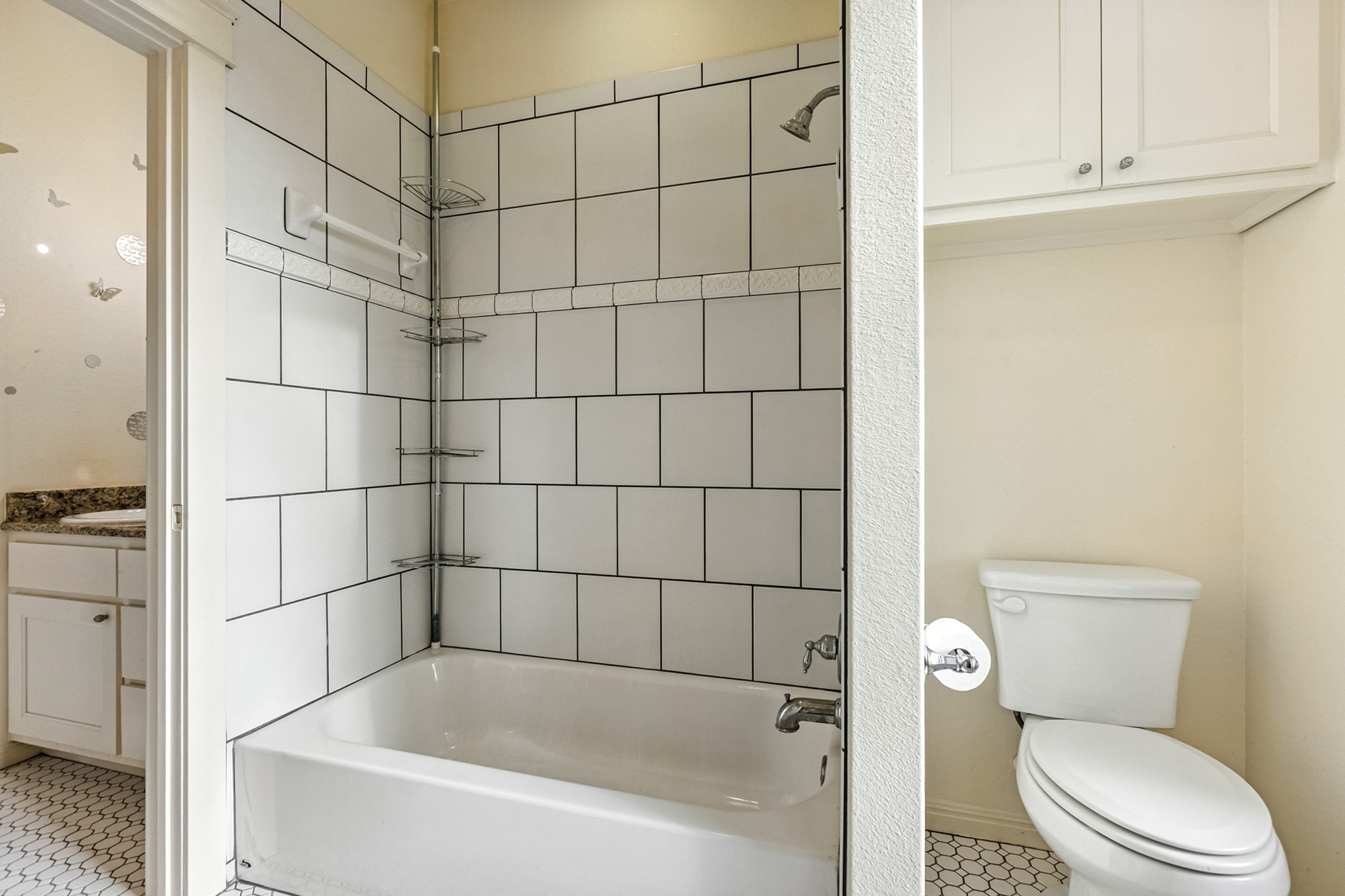 498 North County Line Road Elgin, TX 78621 - Photo 39 of 40 Bathroom featuring bathtub / shower combination, vanity, and light tile patterned flooring