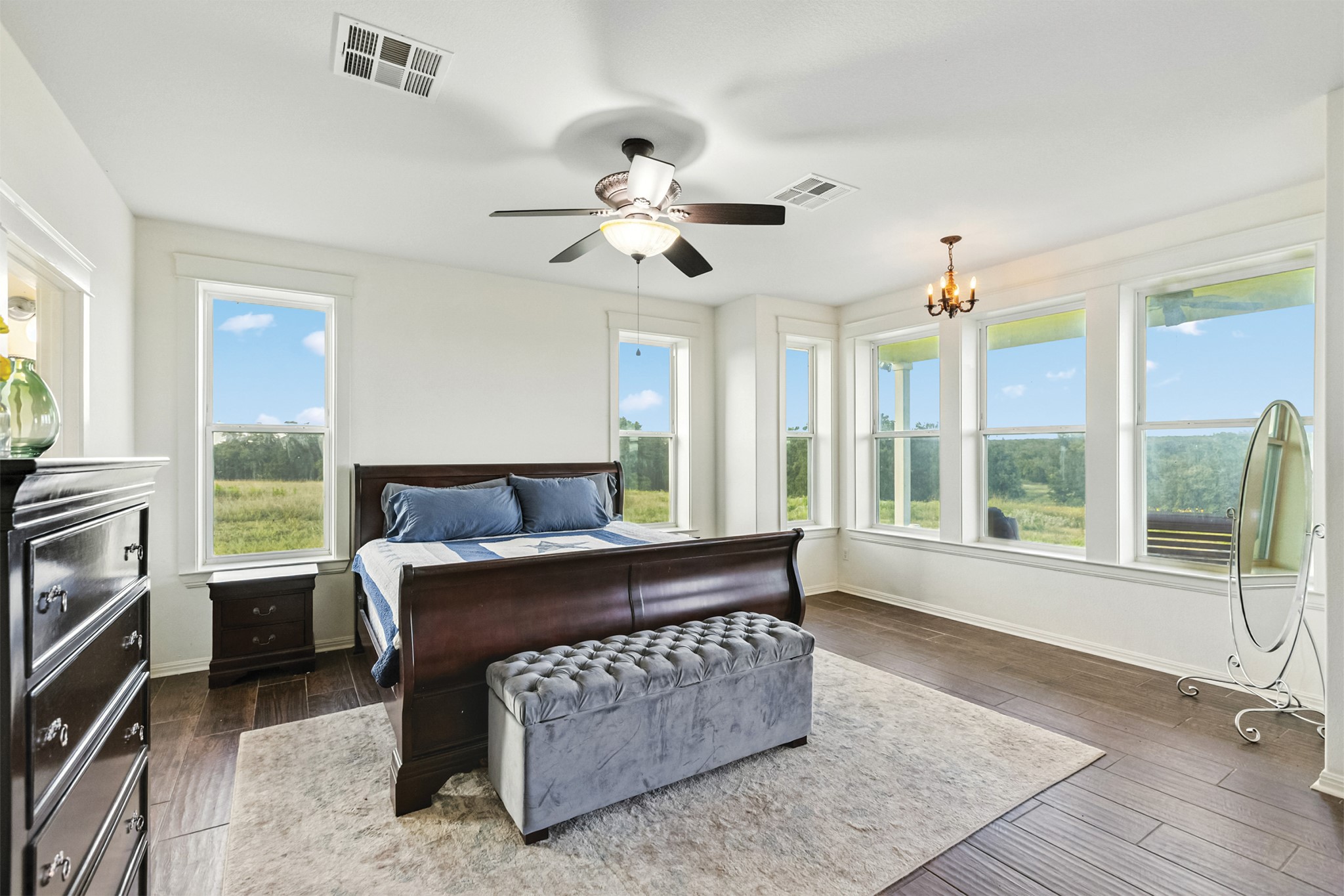 498 North County Line Road Elgin, TX 78621 - Photo 5 of 40 Bedroom featuring a chandelier, a ceiling fan, and dark wood-style flooring
