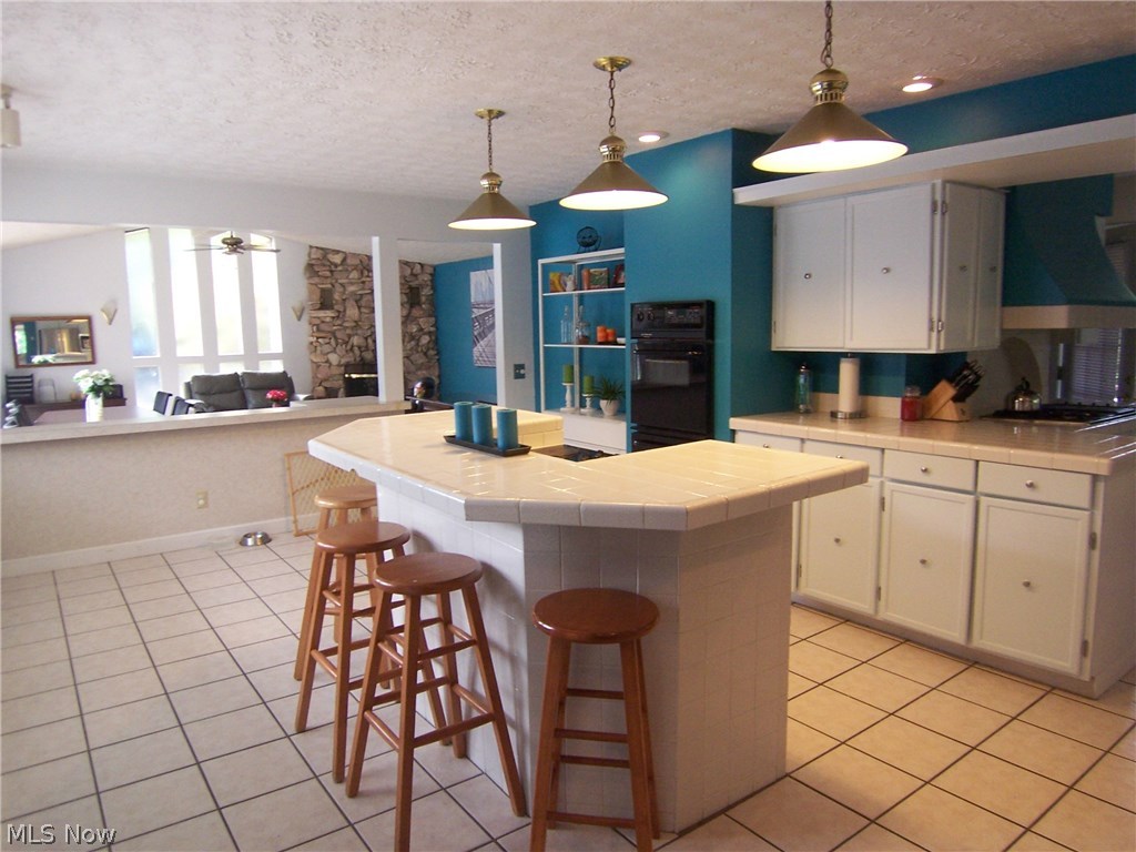 122 Rector Road Parkersburg, WV 26104 - Photo 35 of 35 There are two cook tops in the kitchen area. Gas and electric. Open floor plan to the familyroom.
