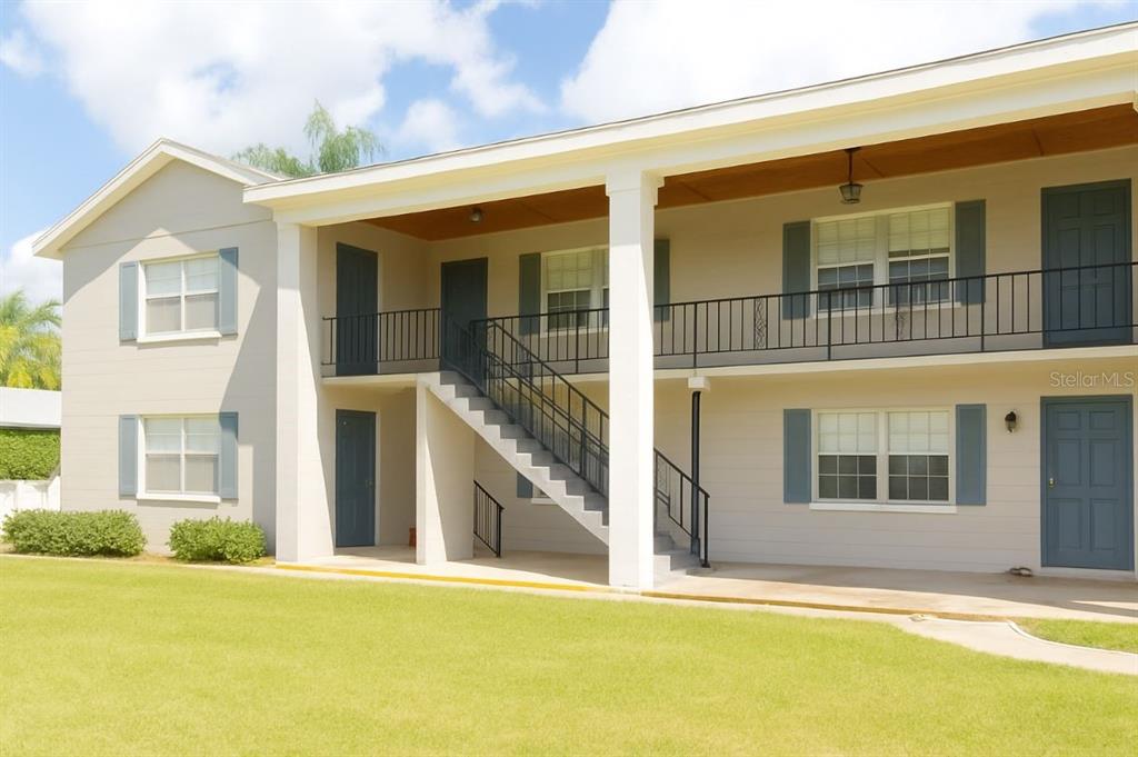 a view of a large building with a swimming pool