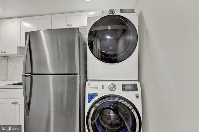 a close view of utility and utility room with washer and dryer