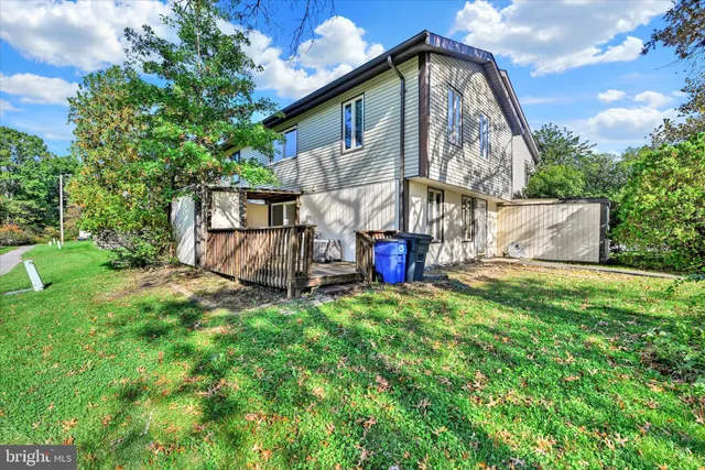 a view of backyard with a garden and deck