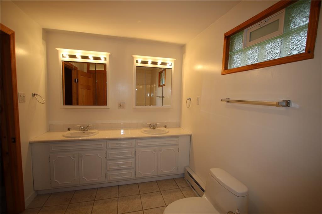 2620 Douglas Run Road Elizabeth, PA 15037 - Photo 8 of 25 HUGE Updated 1st Floor Bathroom w/ Ceramic Tile Flooring, Attractive Glass Block Window & Double Sinks & Vanity