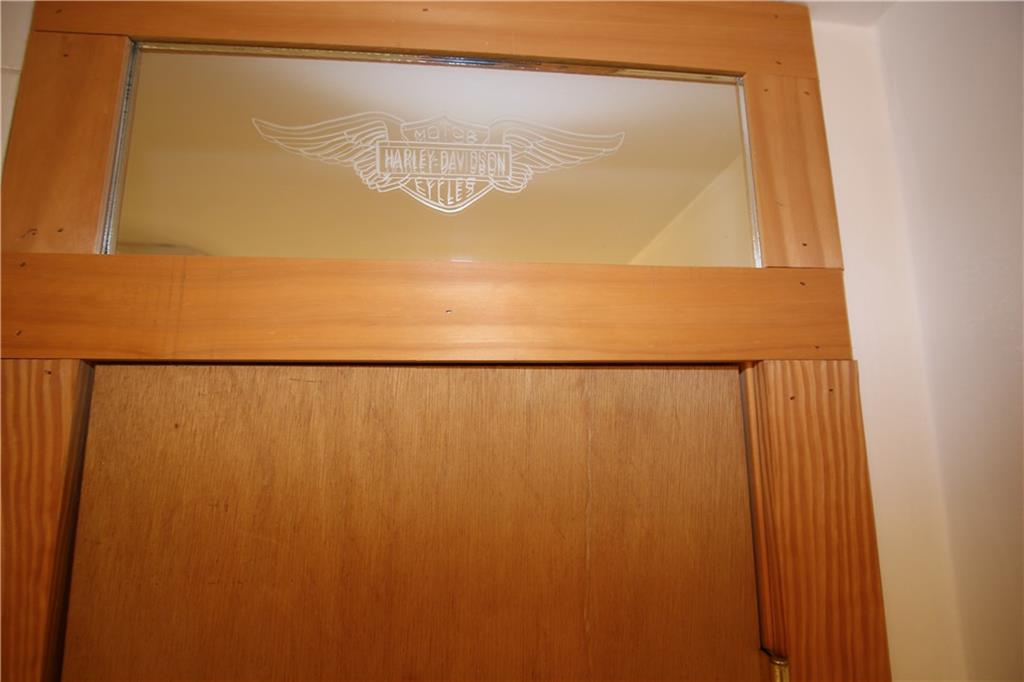 2620 Douglas Run Road Elizabeth, PA 15037 - Photo 9 of 25 Attractive Harley-Davidson Engraved Glass above Shelved Linen Closet in 1st Floor Bathroom
