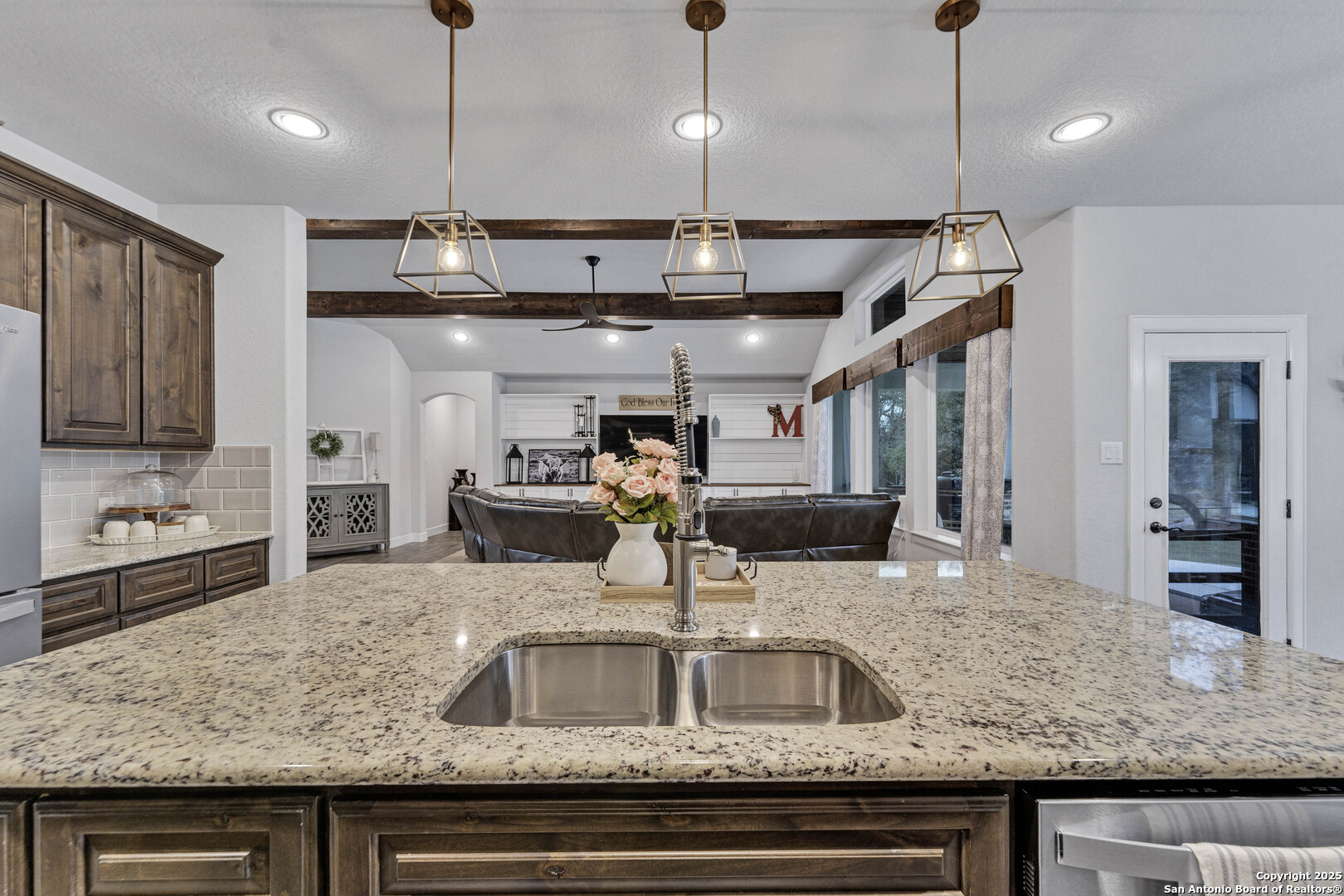 1033 Mystic Shores Boulevard Spring Branch, TX 78070 - Photo 19 of 39 a kitchen with kitchen island a sink and center island