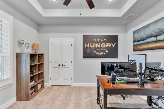 a workspace with furniture and window