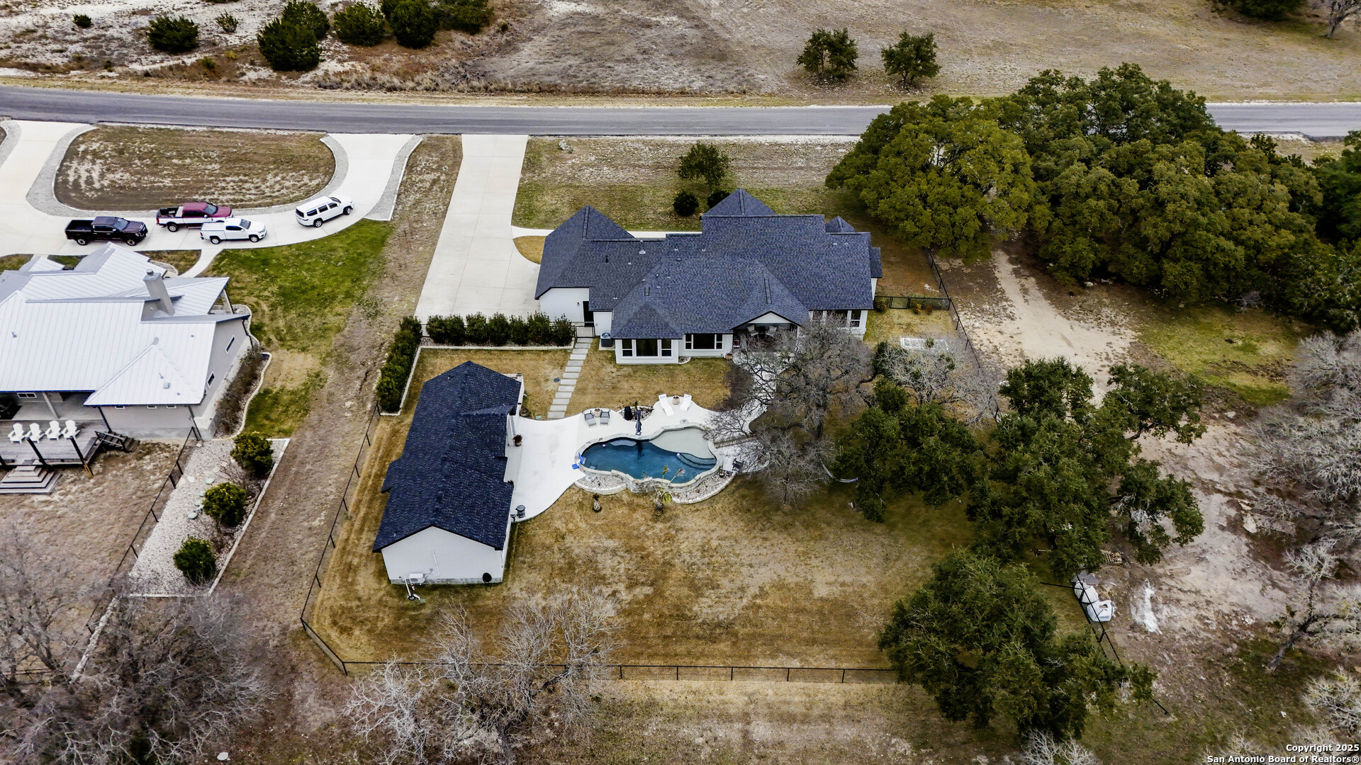 1033 Mystic Shores Boulevard Spring Branch, TX 78070 - Photo 3 of 39 an aerial view of a house with a swimming pool