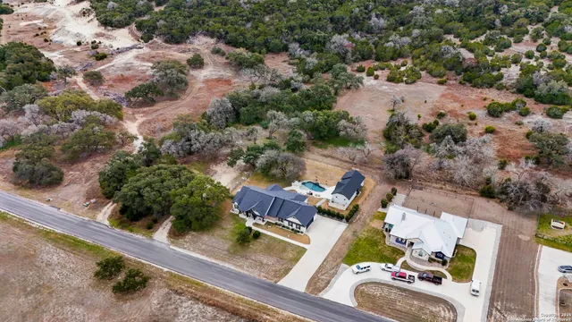 an aerial view of house with yard