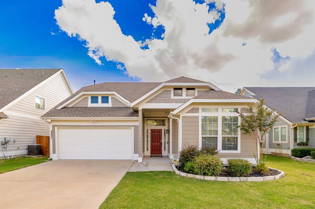 9821 Wild Ginger Drive McKinney, TX 75072 - Photo 1 of 1 a front view of a house with a yard and garage