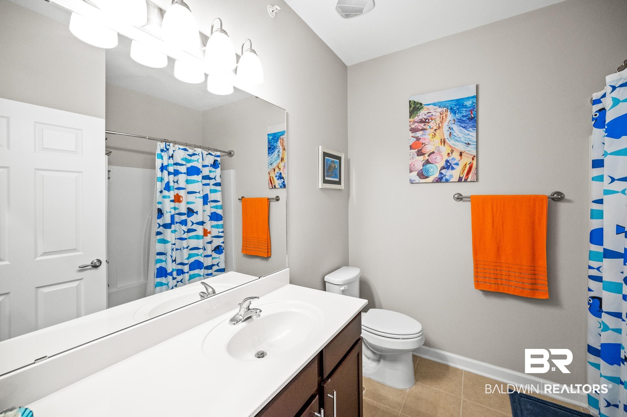 430 West Fort Morgan Road, Unit 1902 Gulf Shores, AL 36542 - Photo 32 of 59 Bathroom with vanity, tile patterned flooring, and toilet