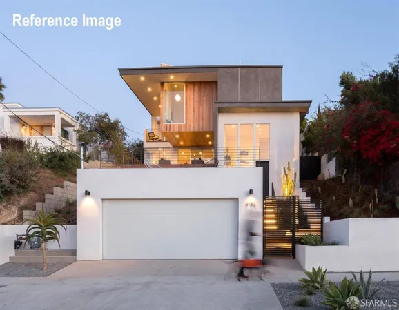 a view of a house with a patio and a yard