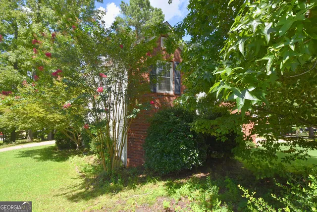 a backyard of a house with lots of green space