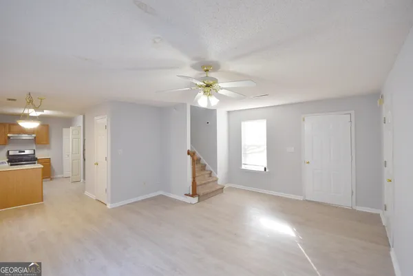 a view of an empty room with a window
