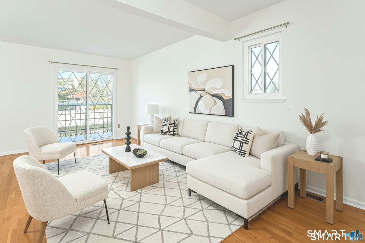 54 Hope Street, Unit 4 Stamford, CT 06906 - Photo 1 of 1 a living room with furniture and a table