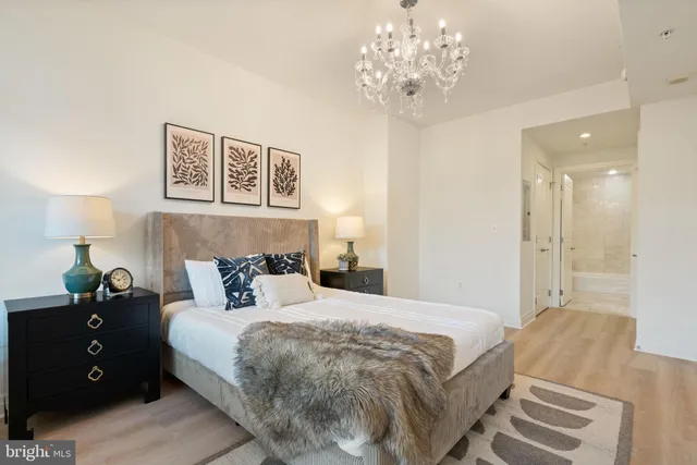 a bedroom with a bed and a lamp