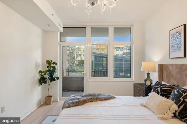 a bathroom with a shower and a glass door