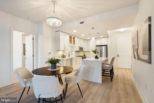a kitchen with a sink and refrigerator