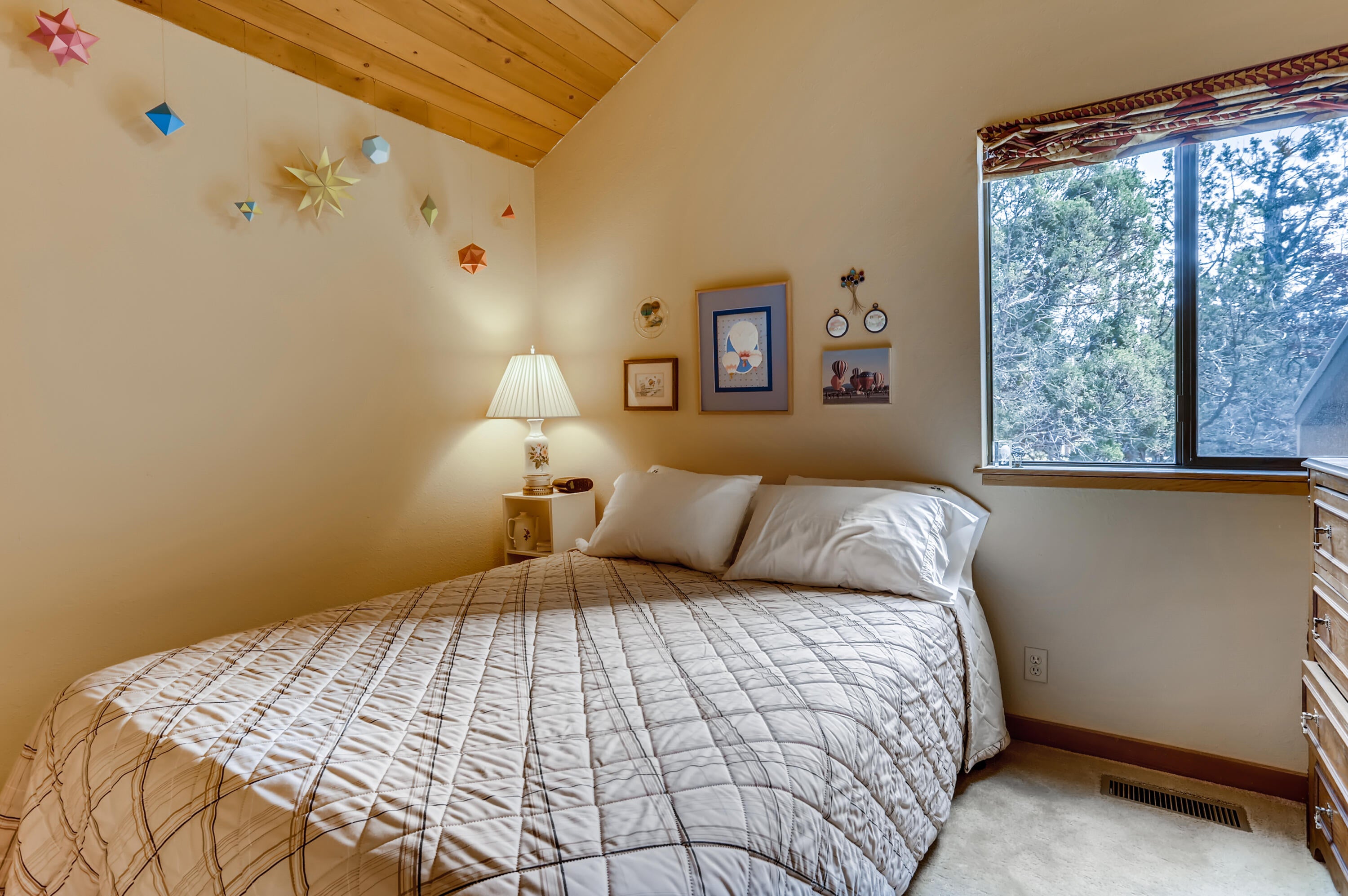 19695 Ridgewood Drive Bend, OR 97703 - Photo 14 of 21 2nd bedroom, with vaulted wood ceiling.