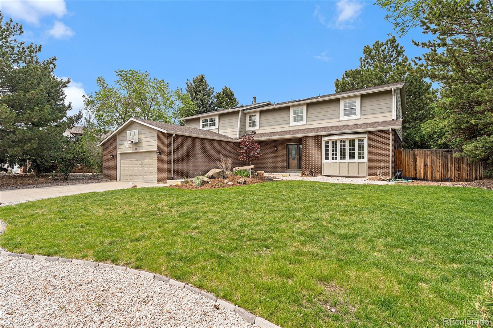 217 South Deframe Way Golden, CO 80401 - Photo 1 of 34 a front view of a house with garden
