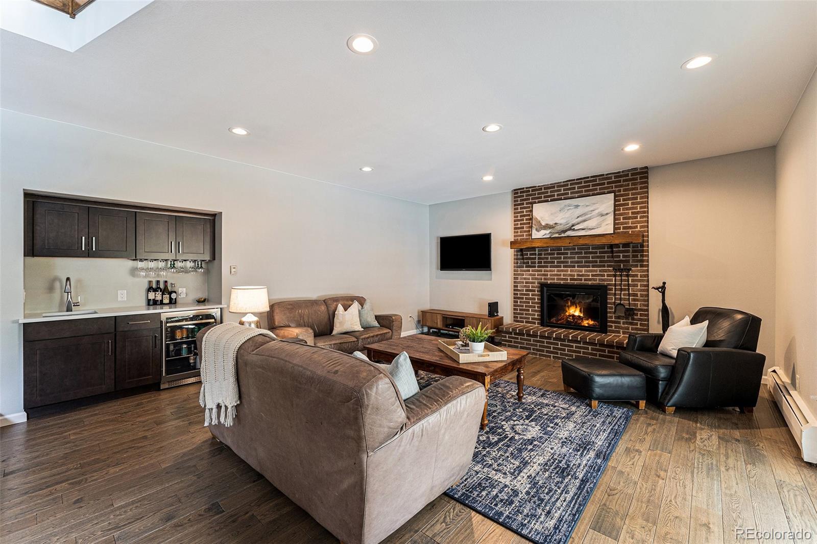 217 South Deframe Way Golden, CO 80401 - Photo 11 of 34 a living room with furniture and a fireplace