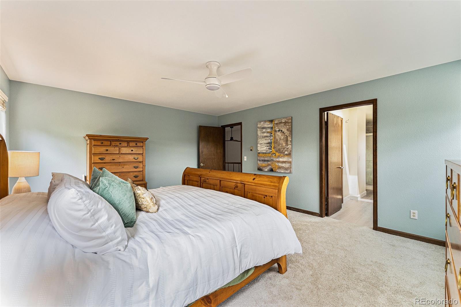 217 South Deframe Way Golden, CO 80401 - Photo 20 of 34 a bedroom with a bed and a dresser
