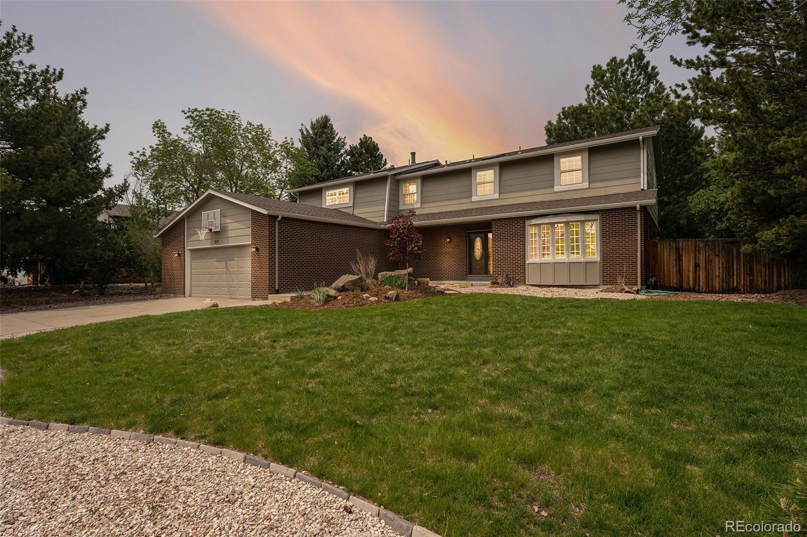 217 South Deframe Way Golden, CO 80401 - Photo 2 of 34 a front view of house with yard and green space