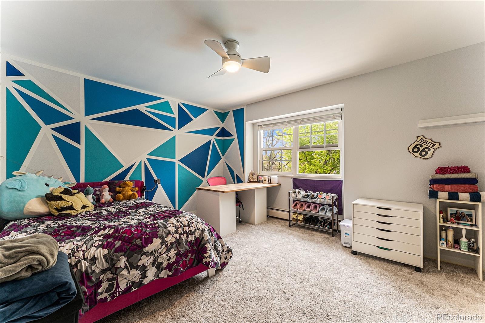 217 South Deframe Way Golden, CO 80401 - Photo 23 of 34 a bedroom with a bed and a window