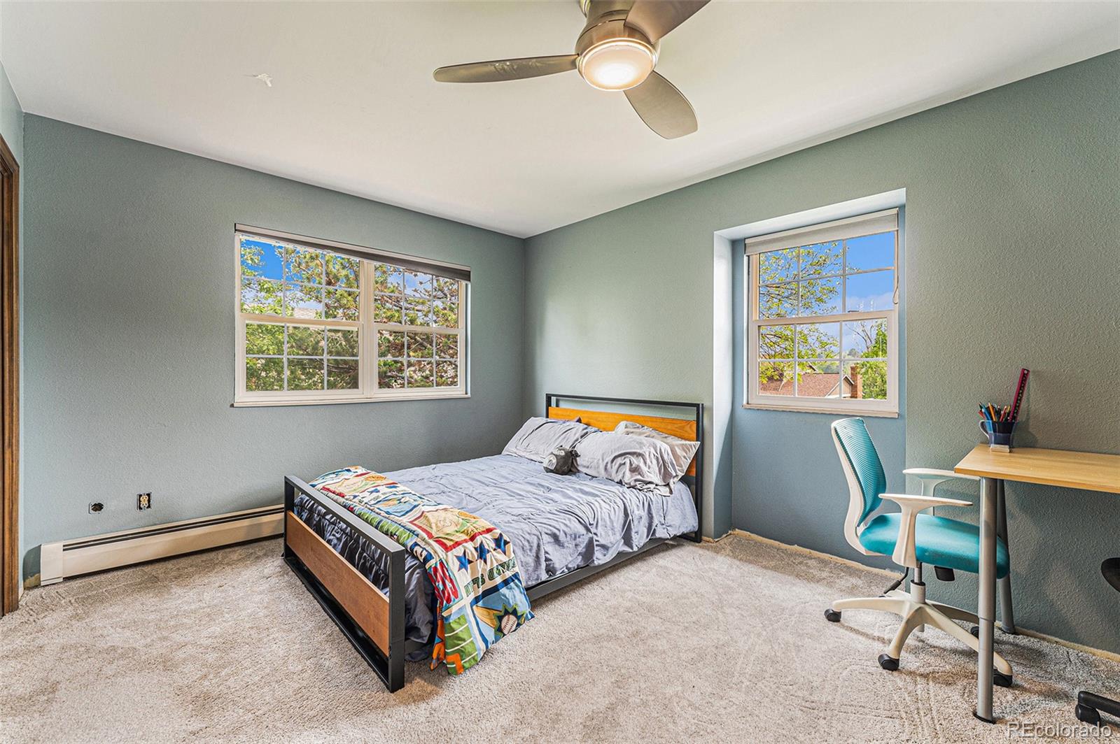 217 South Deframe Way Golden, CO 80401 - Photo 25 of 34 a bedroom with a bed and a window