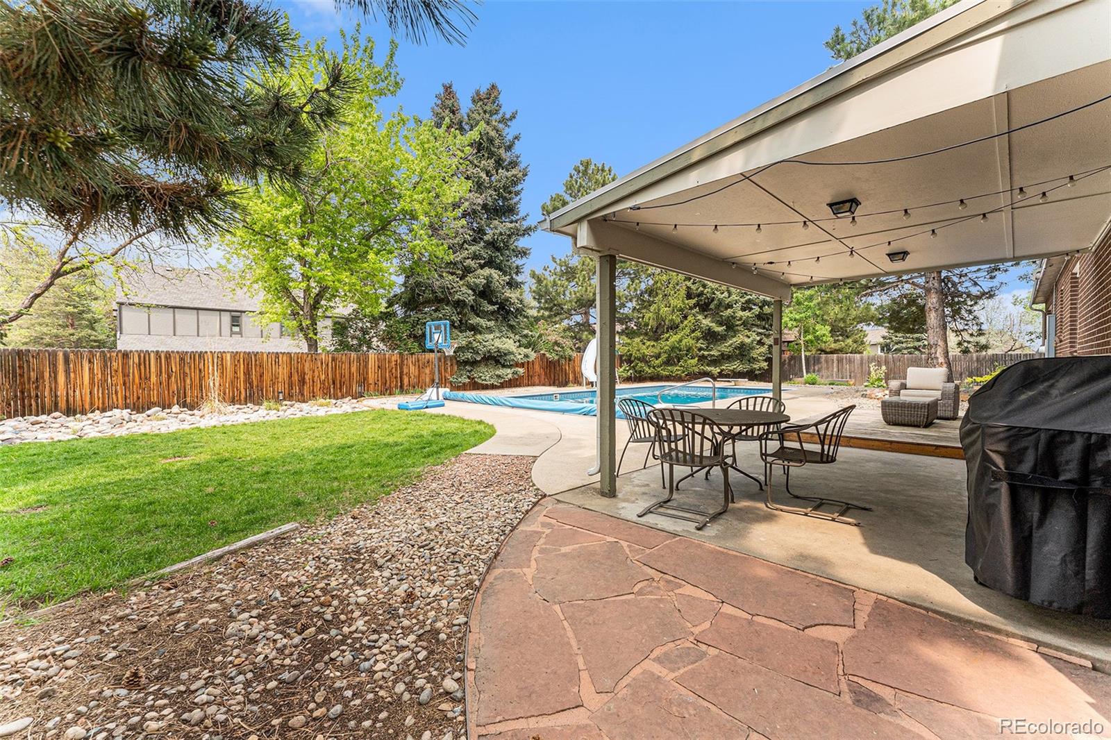 217 South Deframe Way Golden, CO 80401 - Photo 27 of 34 a view of a patio with a table and chairs