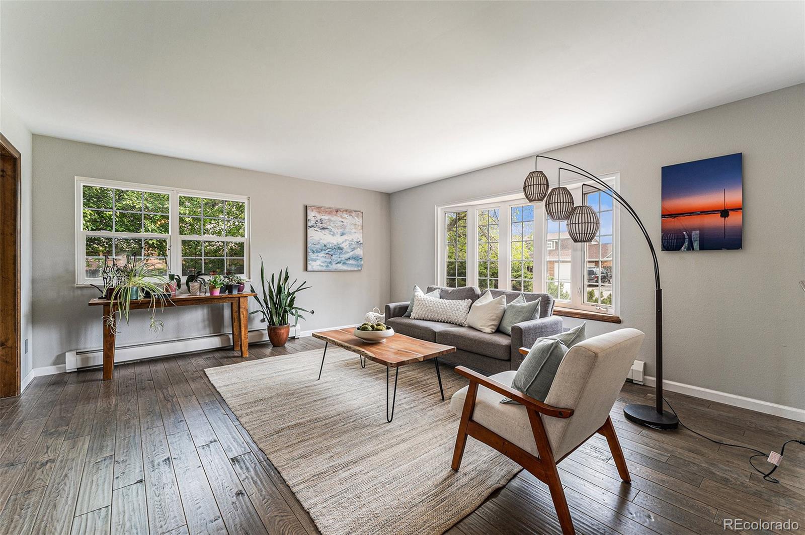 217 South Deframe Way Golden, CO 80401 - Photo 4 of 34 a living room with furniture and a wooden floor