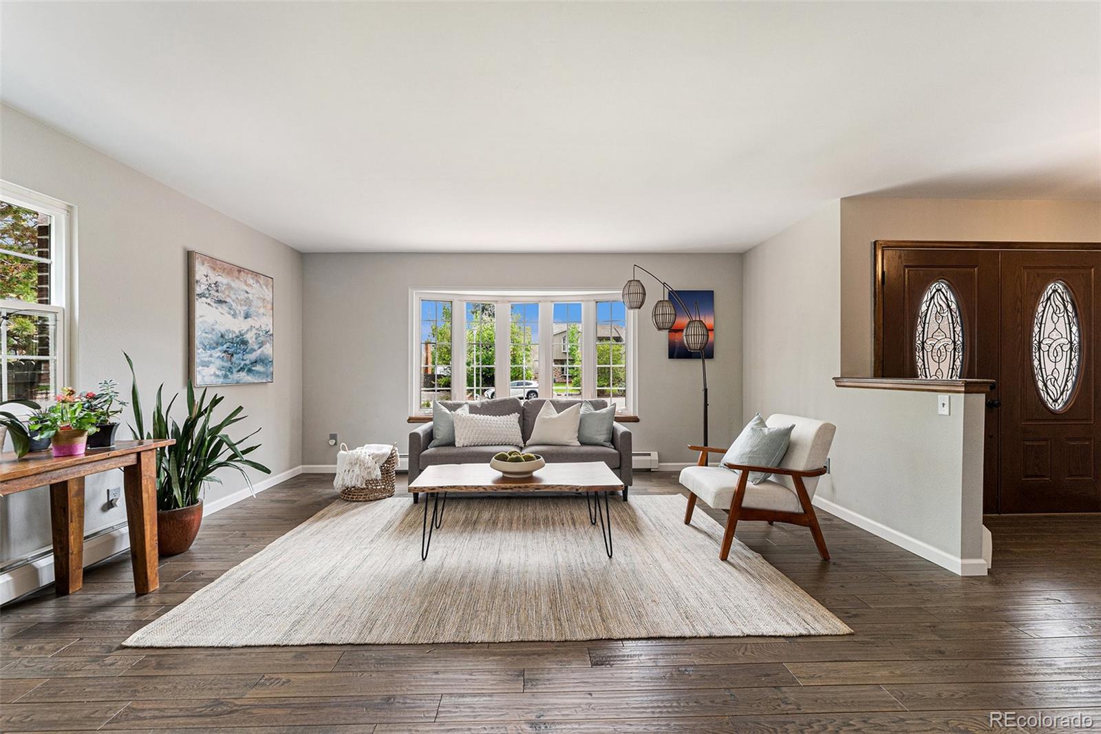217 South Deframe Way Golden, CO 80401 - Photo 5 of 34 a living room with furniture and wooden floor