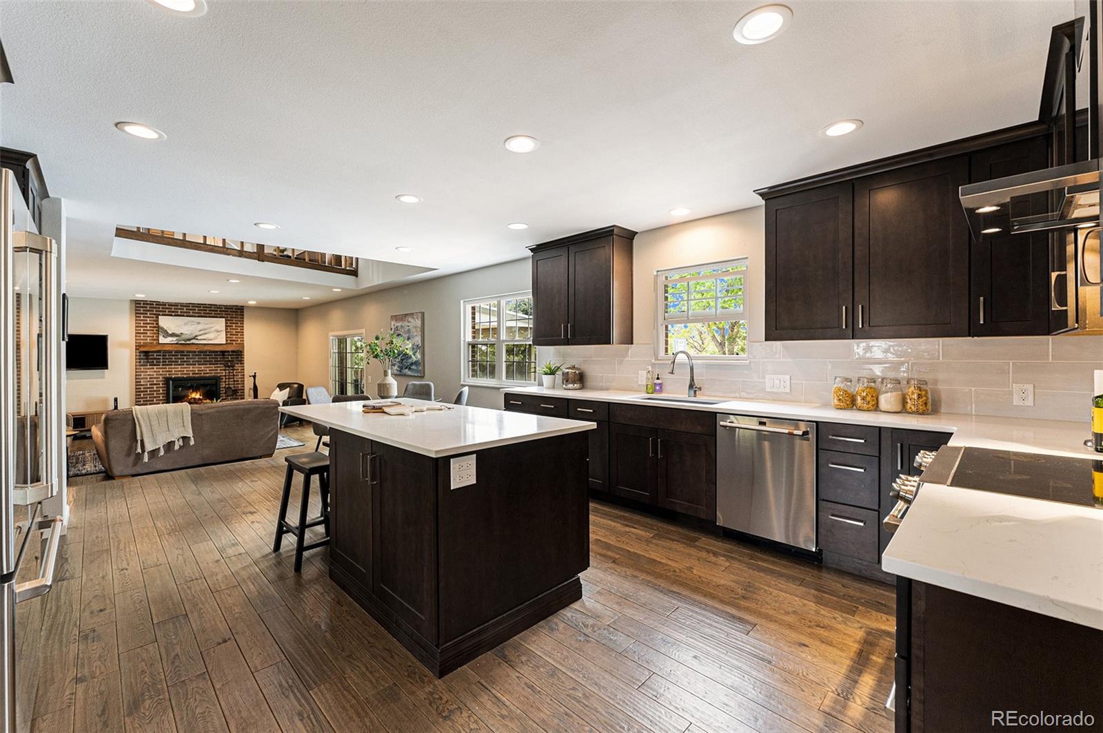 217 South Deframe Way Golden, CO 80401 - Photo 6 of 34 a kitchen with a sink cabinets and wooden floor