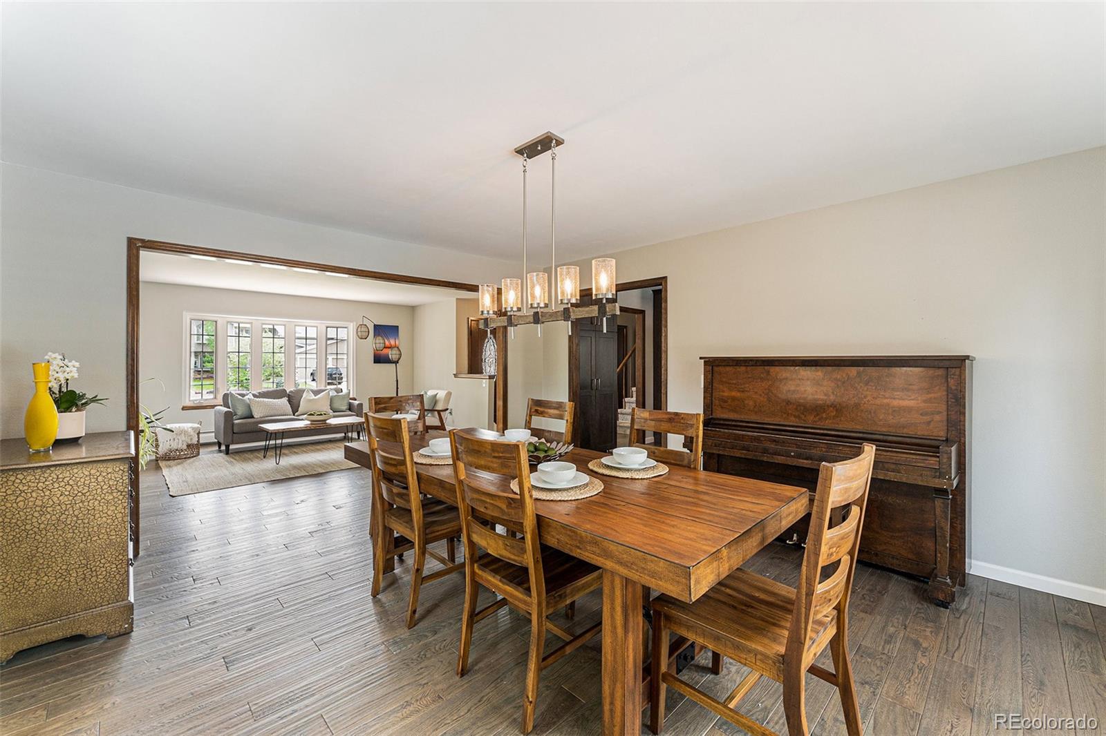 217 South Deframe Way Golden, CO 80401 - Photo 9 of 34 a view of a dining room with furniture window and wooden floor