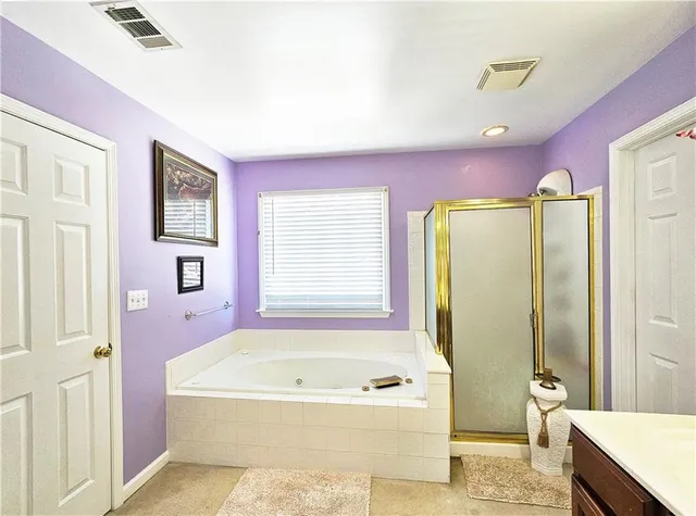 a room with gym equipment and windows