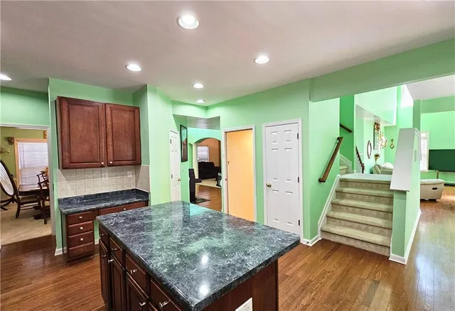 a kitchen with a table and chairs in it