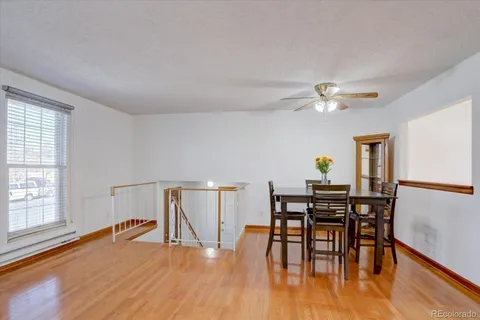 a view of a dining room with furniture and wooden floor