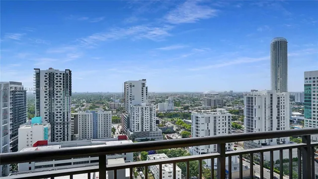 a view of a city skyline from a balcony