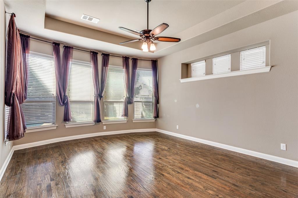 1505 5th Street Argyle, TX 76226 - Photo 14 of 25 a view of room with window ceiling fan and hardwood floor