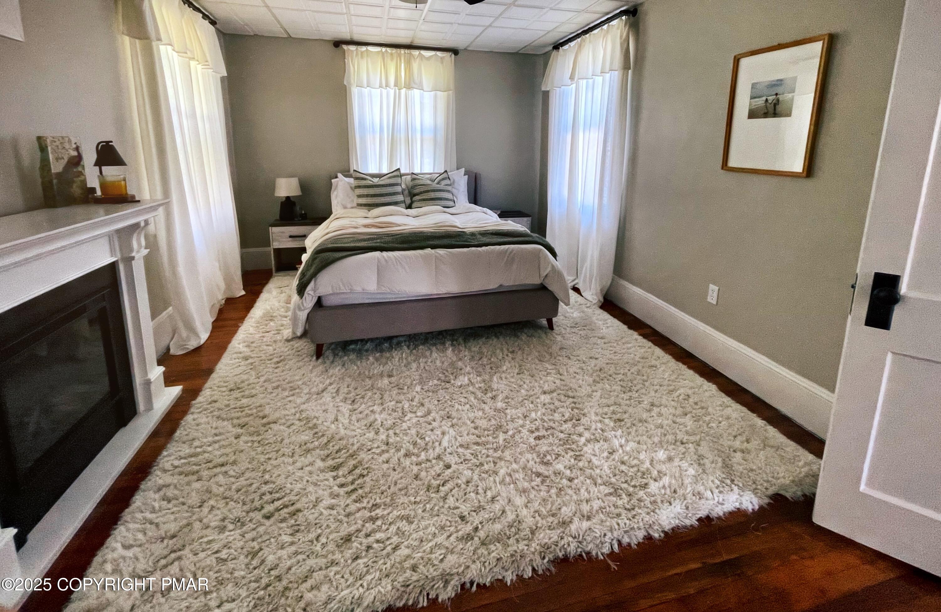 3035 Church Road Mountain Top, PA 18707 - Photo 17 of 27 a spacious bedroom with a bed and a flat tv screen on the dresser