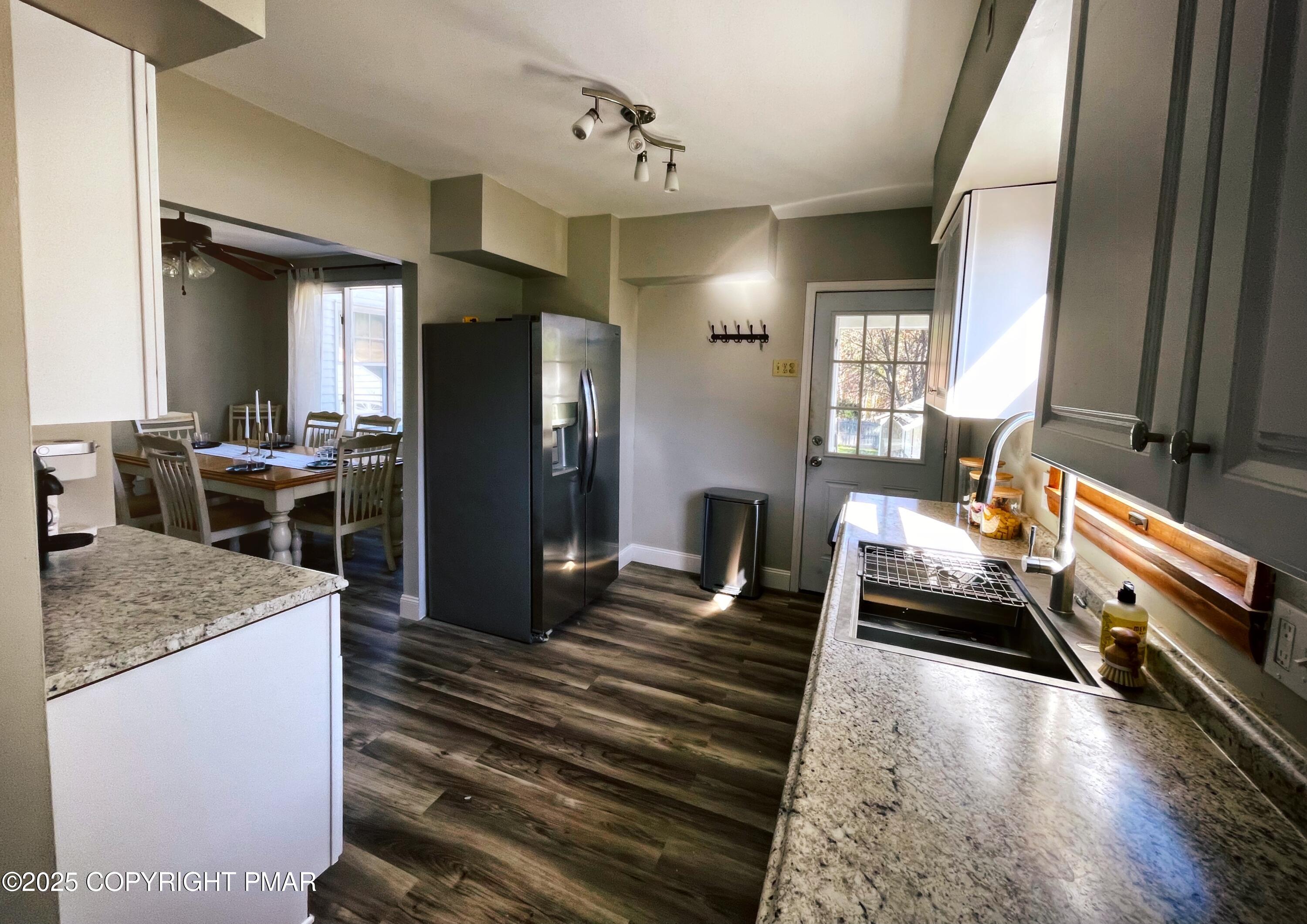 3035 Church Road Mountain Top, PA 18707 - Photo 19 of 27 a kitchen with stainless steel appliances granite countertop a sink stove and refrigerator