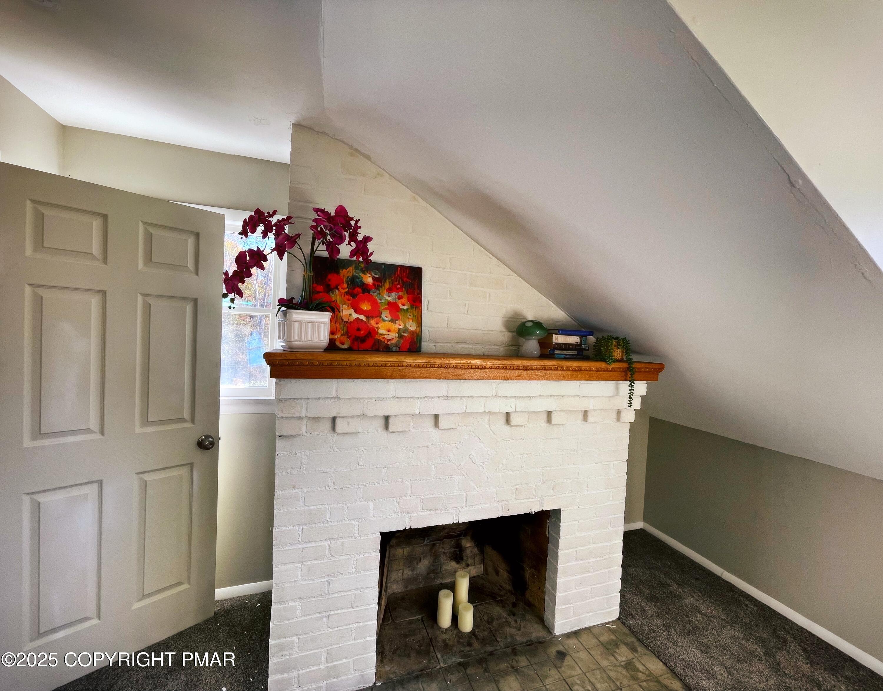 3035 Church Road Mountain Top, PA 18707 - Photo 22 of 27 a hallway with a fireplace and a potted plant