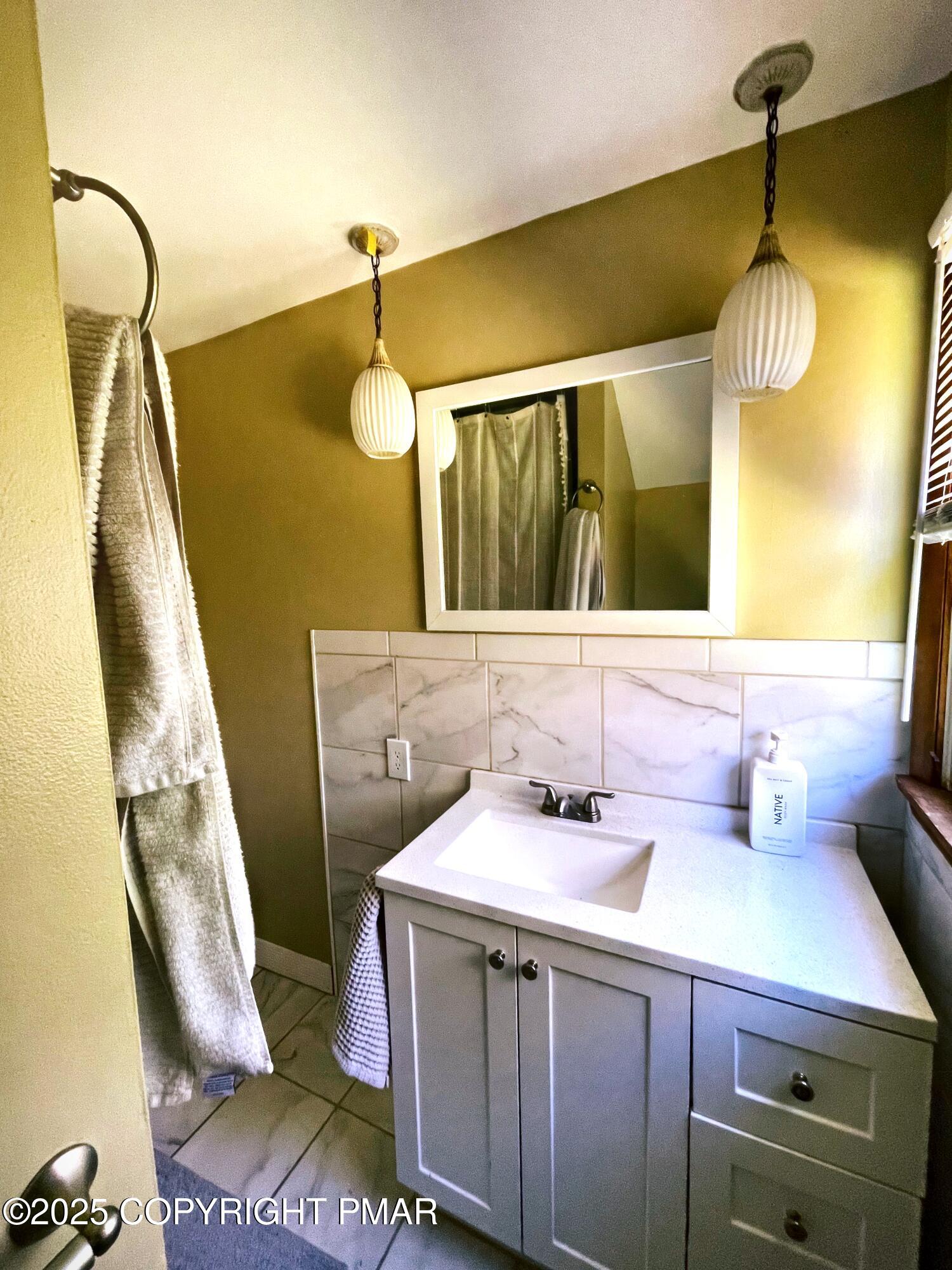 3035 Church Road Mountain Top, PA 18707 - Photo 27 of 27 a bathroom with a sink and mirror