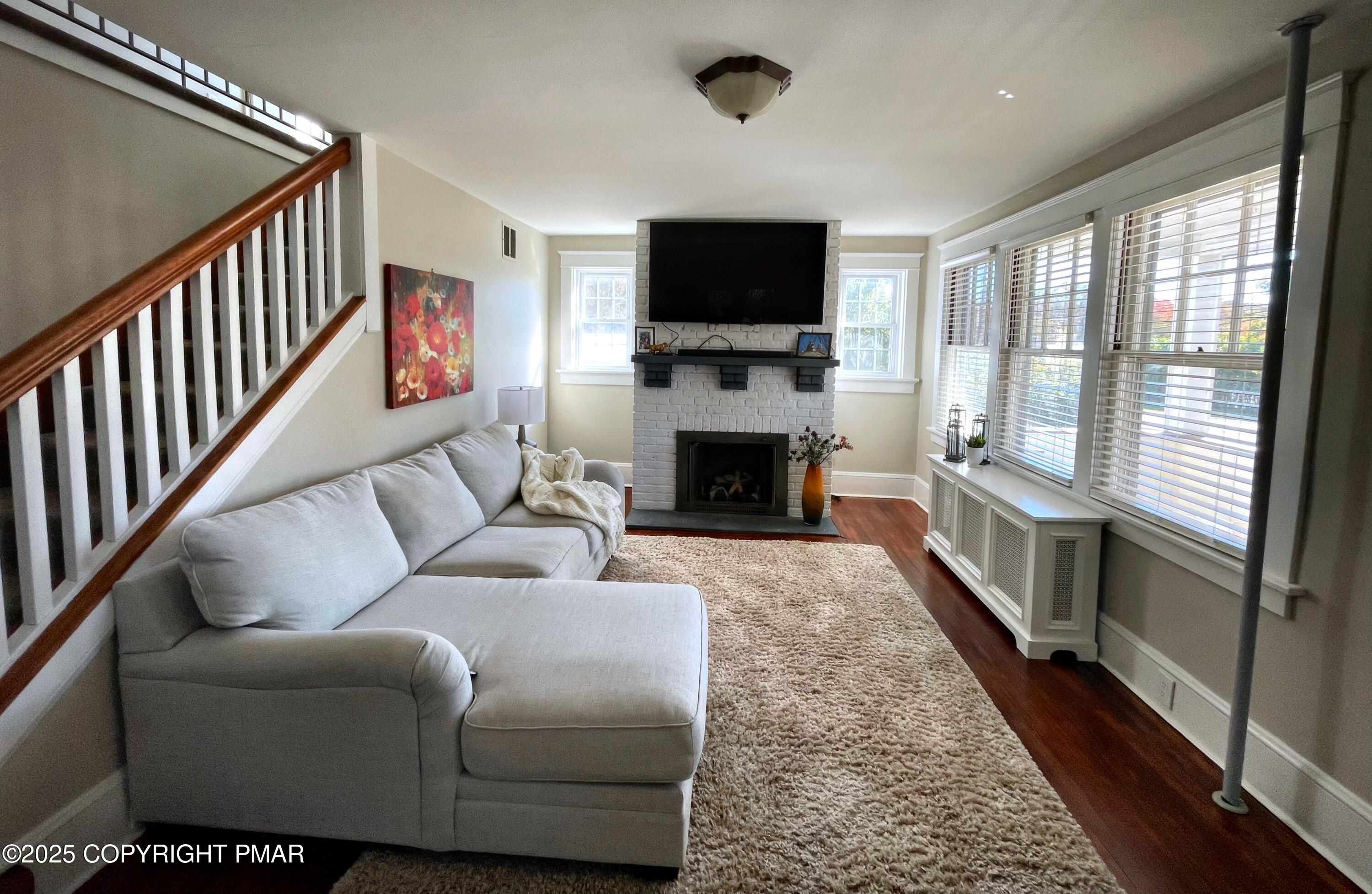 3035 Church Road Mountain Top, PA 18707 - Photo 3 of 27 a living room with furniture flat screen tv and a fireplace