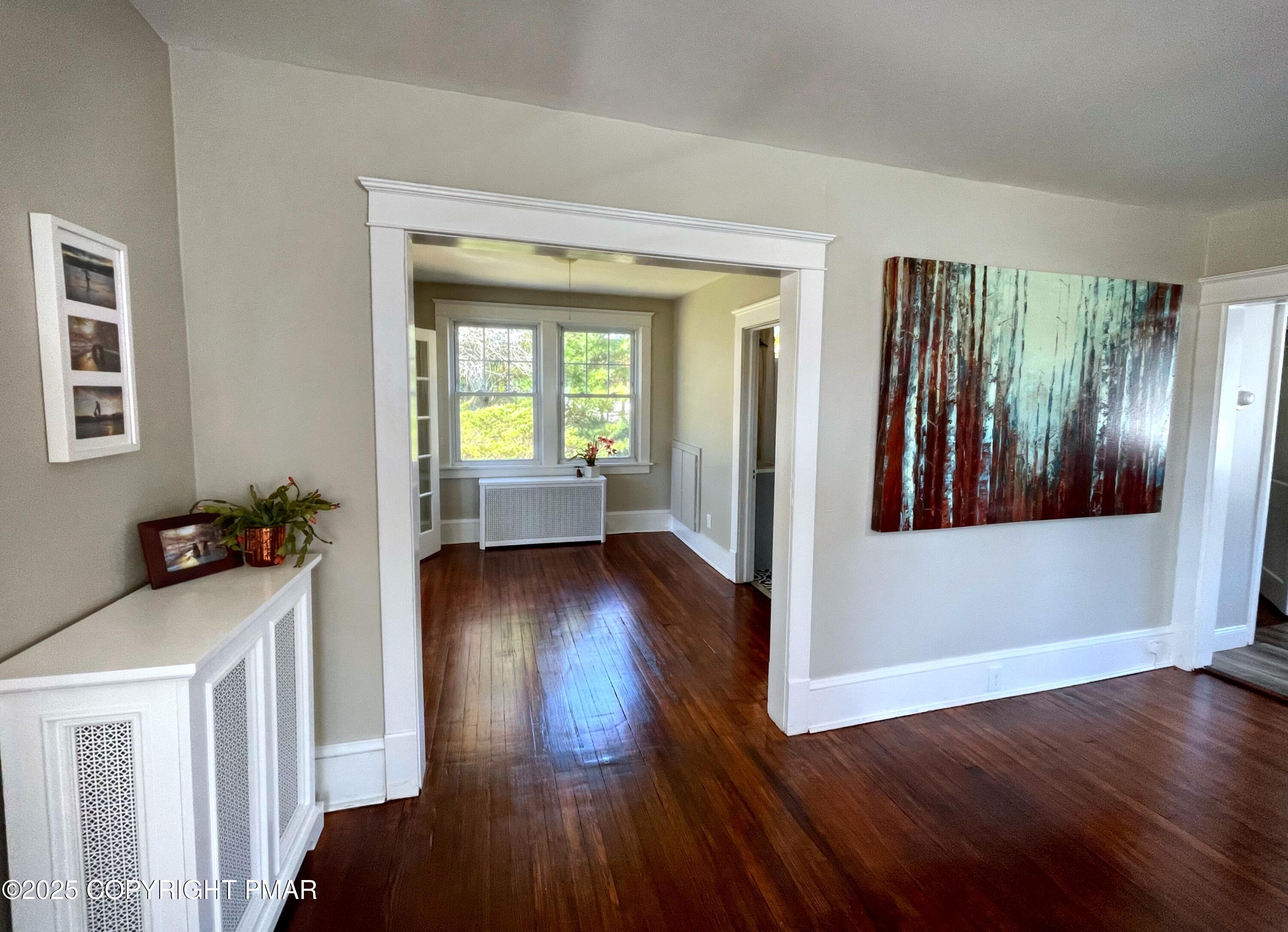 3035 Church Road Mountain Top, PA 18707 - Photo 6 of 27 a view of a hallway with wooden floor and dining room