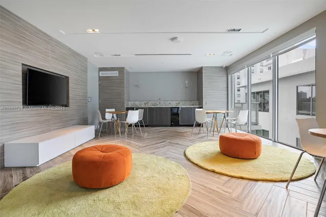 a view of a terrace with furniture and city view