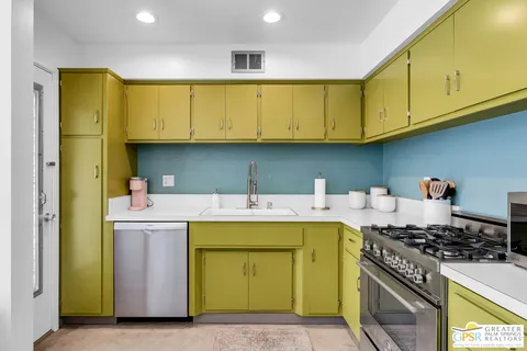 a kitchen with a stove and a cabinets