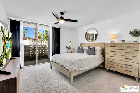 a bedroom with a bed and a table