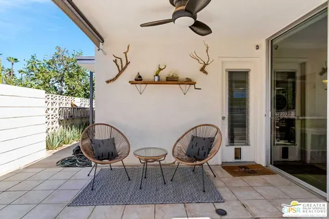 a view of a tables and chair in the patio