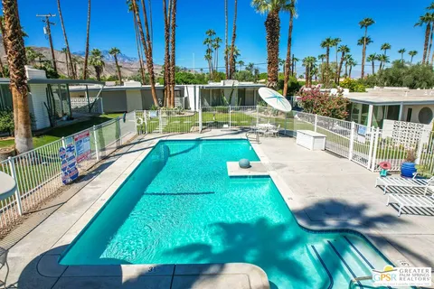 a view of a swimming pool with a lake view